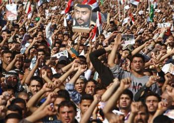 Demonstrators make their voices heard during a rally at Firdos square in Baghdad November 21, 2008. (REUTERS/Ceerwan Aziz)
